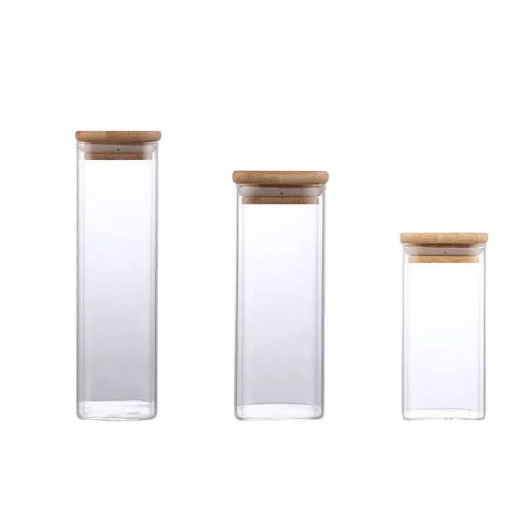طقم برطمانات زجاجي مربع الشكل 3 قطع باحجام مختلفة لحفظ وتخزين الحبوب والبقوليات والتوابل بغطاء خشبي
