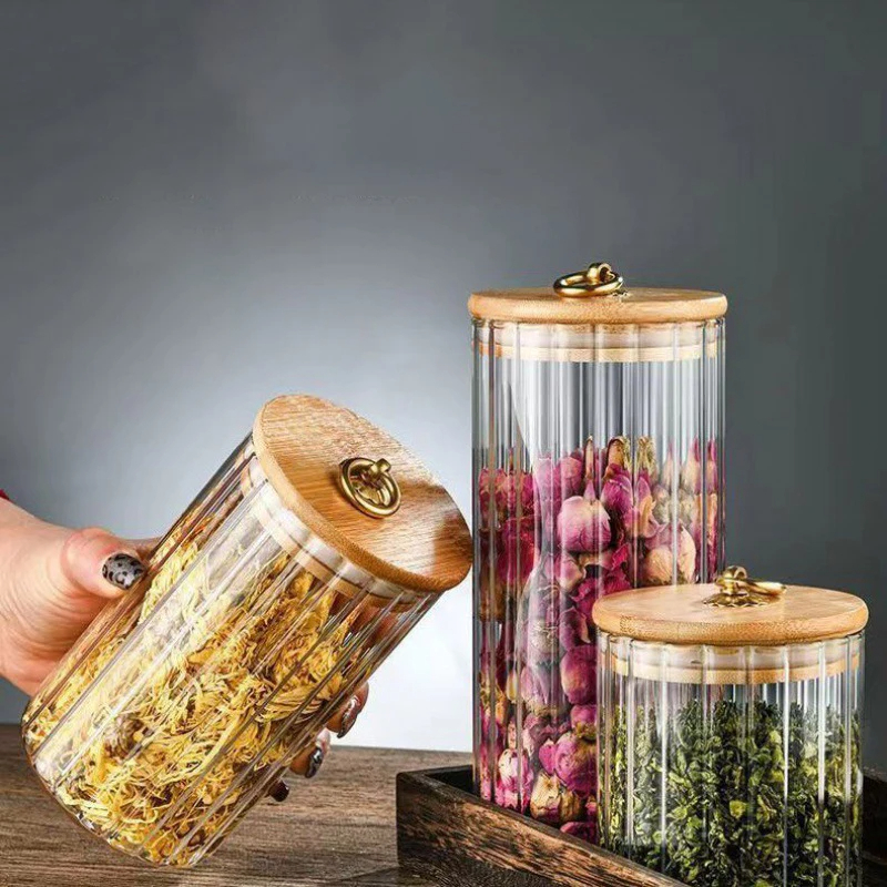 طقم برطمانات زجاج شفاف 3 قطع باحجام مختلفة بغطاء خشبي بحلقة معدن جولد لحفظ وتنظيم الحبوب والبقوليات والشاي والسكر