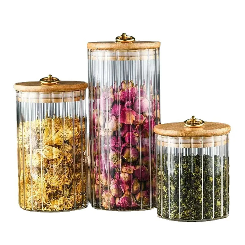 طقم برطمانات زجاج شفاف 3 قطع باحجام مختلفة بغطاء خشبي بحلقة معدن جولد لحفظ وتنظيم الحبوب والبقوليات والشاي والسكر