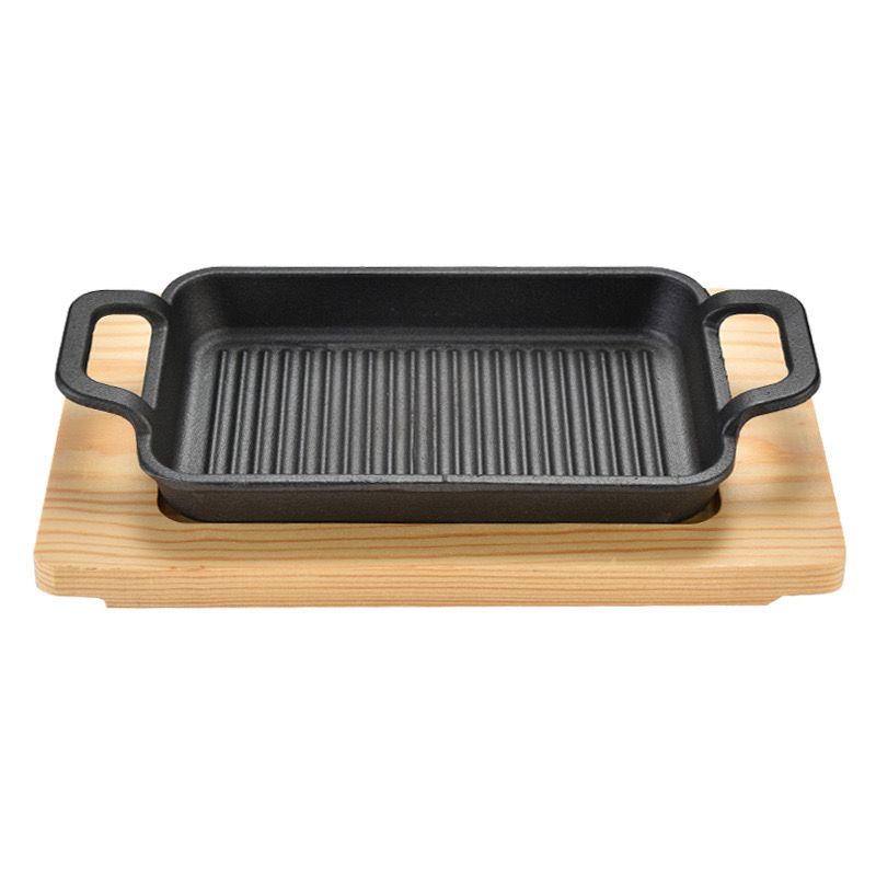 مقلاة  جريل من الحديد الزهر  بيد  مع قاعدة خشب علي شكل مستطيل غير لاصقه