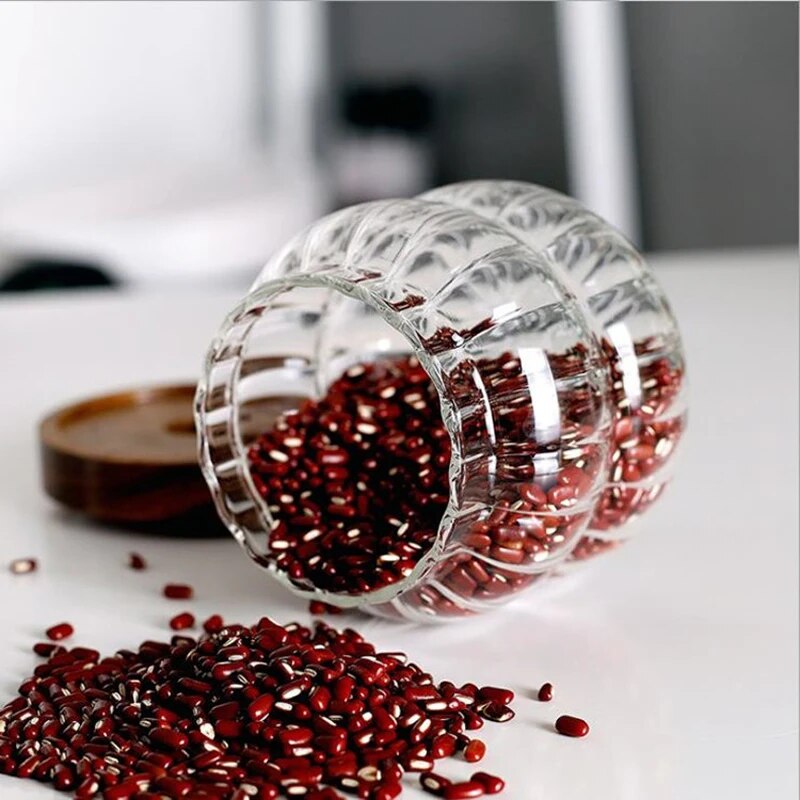 طقم برطمانات 3 قطع احجام مختلفة زجاج زجزاج شفاف بغطاء خشبي محكم الغلق لحفظ وتخزين الشاي والسكر  والبقوليات