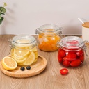 برطمان زجاجي شفاف  بغطاء ومشبك محكم الغلق نصف لتر لحفظ وتخزين المخللات والعسل والسكر