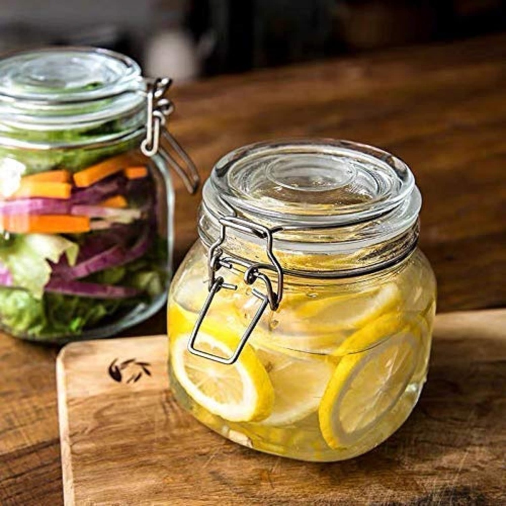 برطمان زجاجي شفاف  بغطاء ومشبك محكم الغلق نصف لتر لحفظ وتخزين المخللات والعسل والسكر