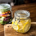 برطمان زجاجي شفاف  بغطاء ومشبك محكم الغلق نصف لتر لحفظ وتخزين المخللات والعسل والسكر