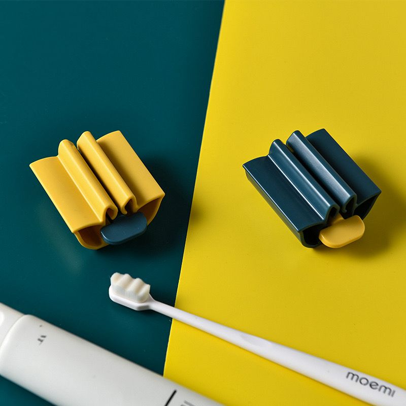 موزع معجون اسنان يدوي دوار لحمله وتوزيعه بسهولة مع مقعد لتثبيته يستخدم لانبوب الاسنان او الكريمات