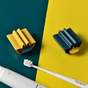 موزع معجون اسنان يدوي دوار لحمله وتوزيعه بسهولة مع مقعد لتثبيته يستخدم لانبوب الاسنان او الكريمات