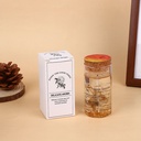 شمعة معطرة برائحة الورد في قالب زجاجي وغطاء خشبي