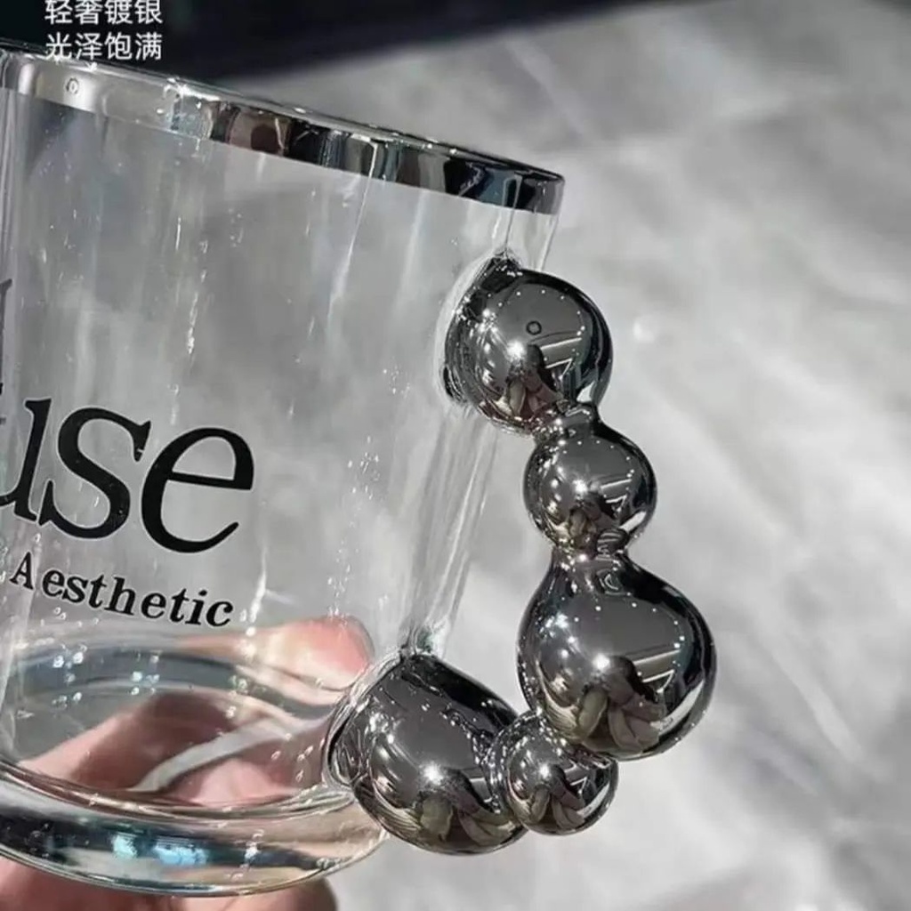 مج بايركس 300 ملي زجاج شفاف و يد علي شكل بابلز باللون السيلفر لشرب العصائر و النسكافيه