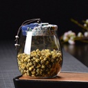 برطمان زجاج شفاف 700 ملي لحفظ البقوليات والمكسرات والكاندي بغطاء محكم الغلق مزين بقماش بورد