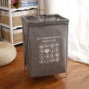 سلة غسيل بكسوة كتان واستاند معدن قابل للطي بيد لسهولة الحمل