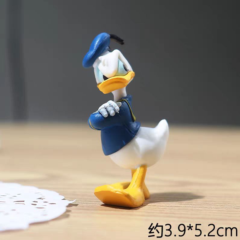 إكسسوار بتصميم بطوط لتزين تابلوه السيارة