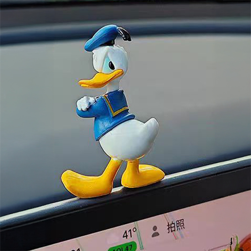 إكسسوار بتصميم بطوط لتزين تابلوه السيارة