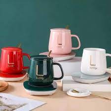 مج بورسلين شيك مع سخان كهربائي ومعلقة للأستمتاع بالقهوة والمشروبات الدافئة في أي مكان